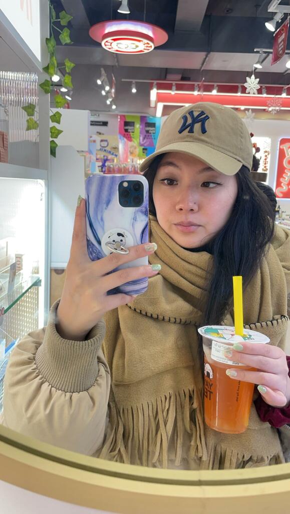 Girl Taking Selfie With Boba Wearing Eyelashes